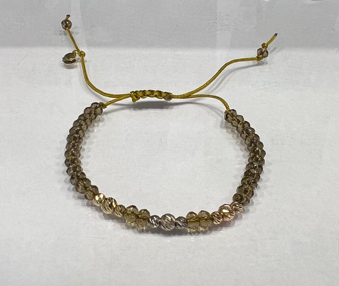 Yellowish Green Gemstones Cord Bracelet in 18K Gold